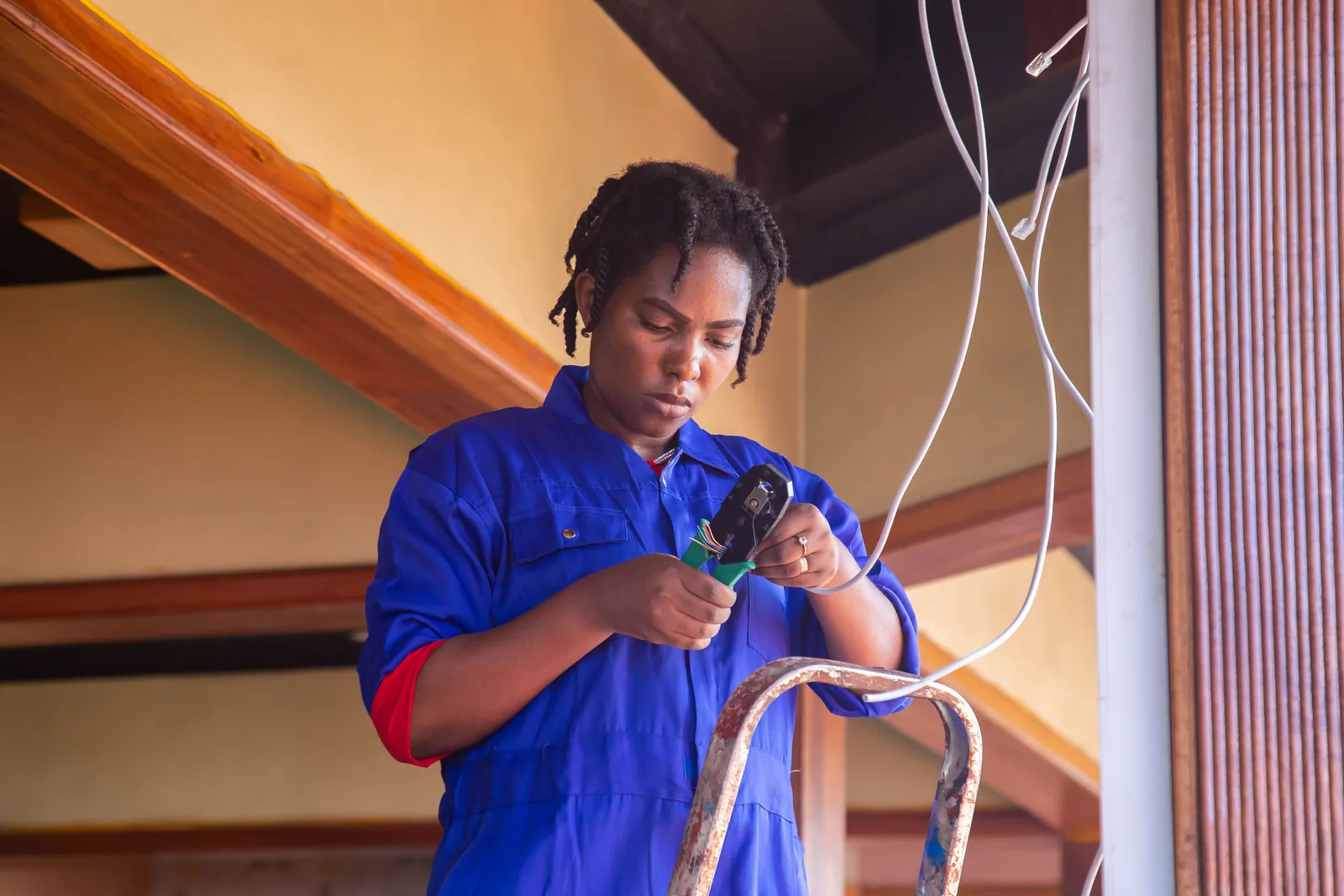 Terminating a cable from a step ladder, for code violation in Buffalo