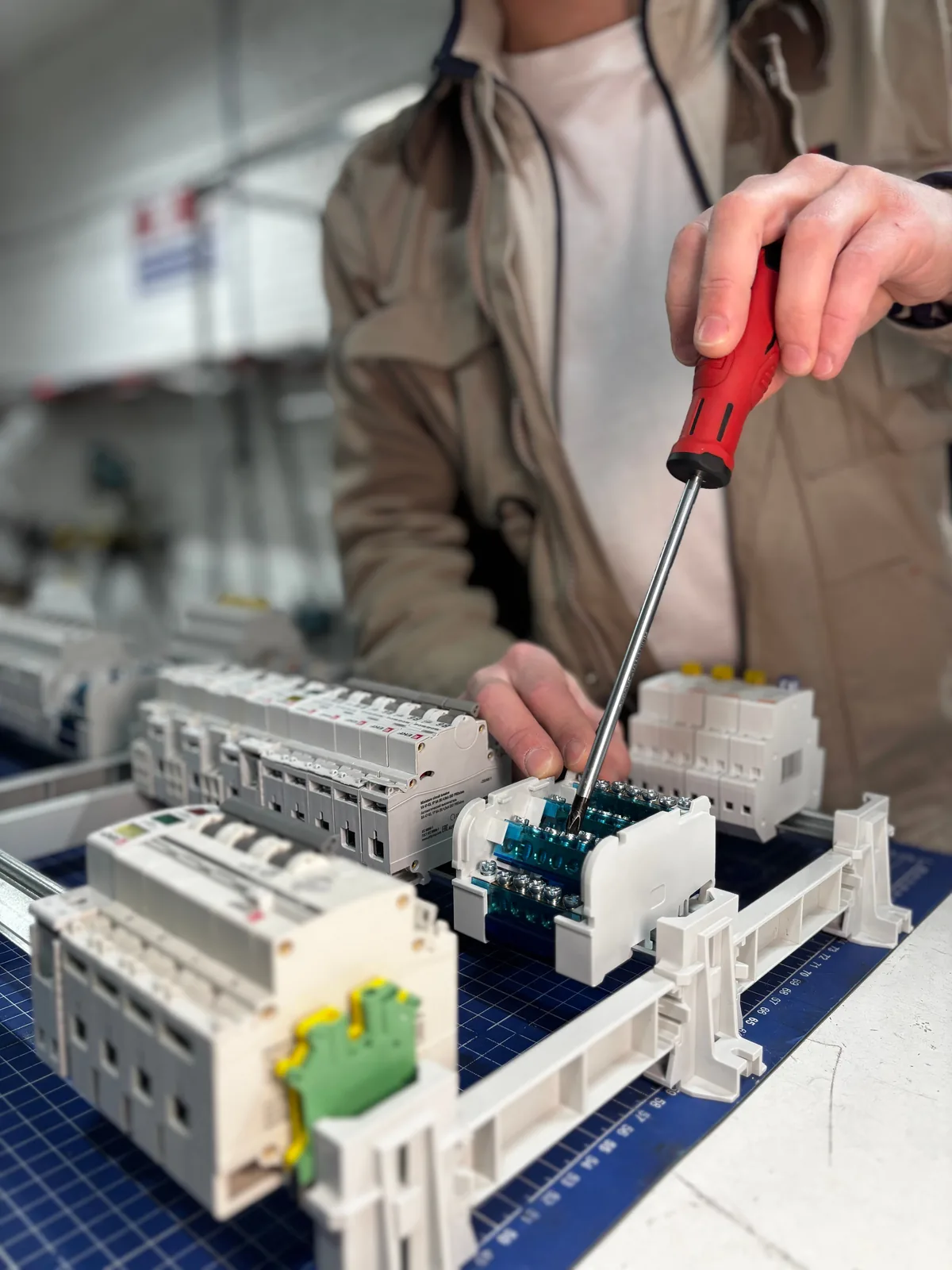 Breakers assembled on a DIN rail before installation, for subpanel installation in Buffalo