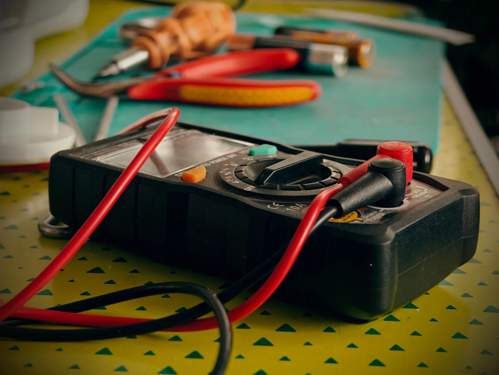 A multimeter and hand tools ready for a diagnostic visit, for electrician in Buffalo