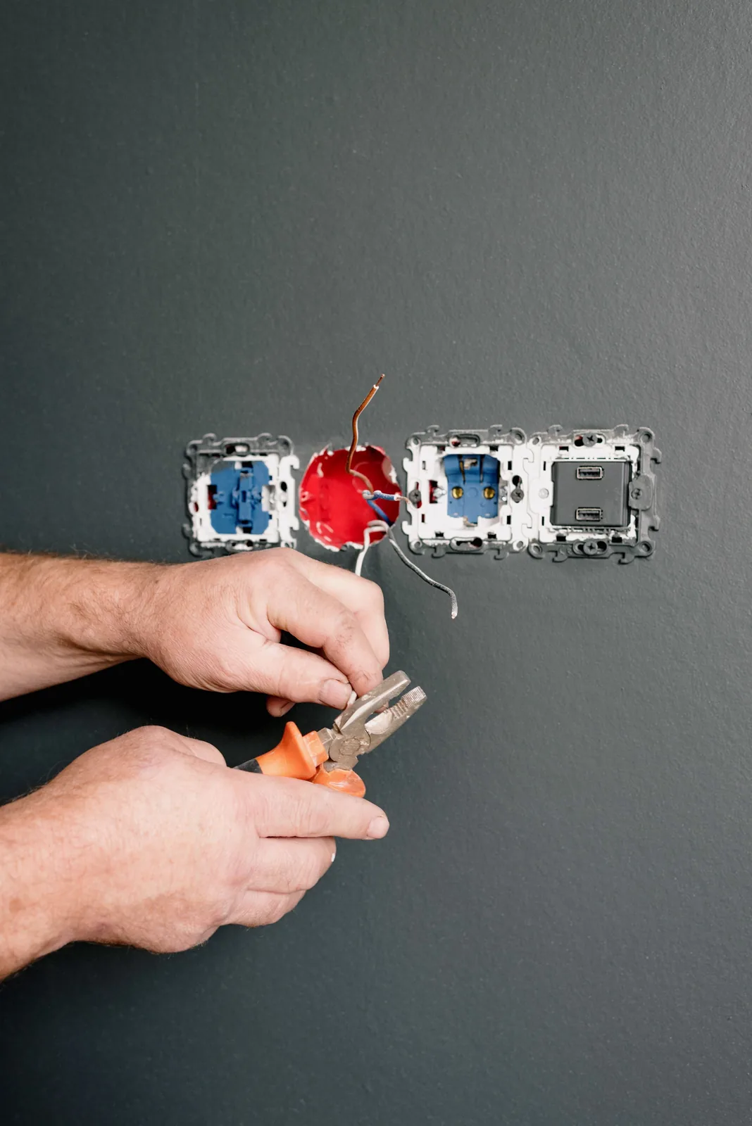 Wiring an outlet box into a finished wall, for code violation in Buffalo