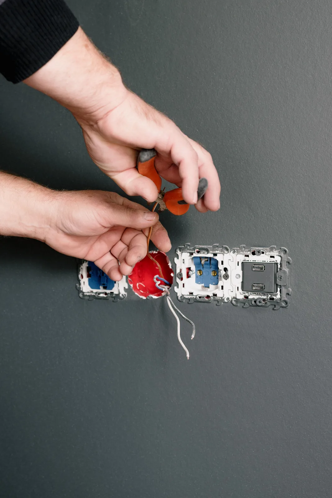 Stripping conductors at an outlet box, for outlet installation in Buffalo