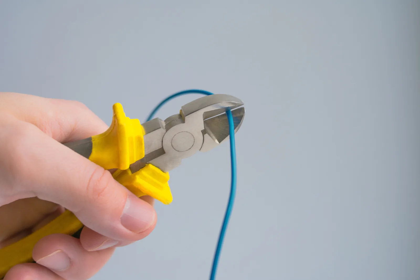 Cutting a conductor to length, for outlet installation in Buffalo